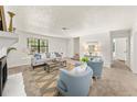 Bright living room features neutral colors, an area rug, and modern decorations at 277 Hope Dr, Dallas, GA 30157