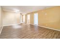 Spacious living room with neutral paint, new wood floors and ample natural light at 256 Olde Oaks Ln, Riverdale, GA 30274