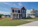 Beautiful two-story home with a classic design and a spacious green lawn at 4040 Andover Cir, Mcdonough, GA 30252