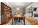 Inviting dining room with stylish chandelier and views into other living spaces at 5002 Davenport Pl, Roswell, GA 30075