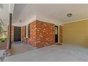 Covered carport area showing brick detail, entry doors and concrete parking surface at 4941 Crowe Se Dr, Smyrna, GA 30082