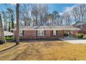 Attractive brick home featuring a well-manicured lawn and classic design, perfect for a cozy and welcoming feel at 4941 Crowe Se Dr, Smyrna, GA 30082