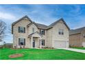 Attractive two-story home with a manicured lawn, two-car garage, and elegant brick exterior at 200 Haverling Pass, Hampton, GA 30228