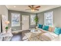 Inviting living room with dark hardwood floors, neutral paint, lots of windows and stylish decor at 385 Arthur Sw St, Atlanta, GA 30310