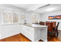 Eat-in kitchen area offering granite countertop and dining area with natural lighting at 8834 Applegate Ln, Atlanta, GA 30350