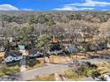 Aerial view of the home in a tranquil neighborhood surrounded by lush greenery and mature trees at 1350 Bluefield Sw Dr, Atlanta, GA 30310