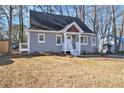 Charming single-story home with a welcoming front porch and a well-maintained lawn at 1350 Bluefield Sw Dr, Atlanta, GA 30310