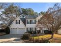 Charming two-story home with a well-maintained lawn and traditional architectural details at 2524 Columbia Crossing Ct, Decatur, GA 30034