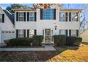 Welcoming front entrance with a decorative door, security gate, and trimmed bushes at 2524 Columbia Crossing Ct, Decatur, GA 30034