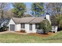 Inviting single-Gathering home with a lush green lawn, offering a serene suburban lifestyle at 2070 Charles Cudd Ct, Lithonia, GA 30058