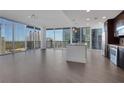 Bright, open living space with floor-to-ceiling windows offering stunning city views at 1080 Peachtree Ne St # 2003, Atlanta, GA 30309