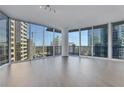 Spacious living room featuring expansive windows and modern design elements at 1080 Peachtree Ne St # 2003, Atlanta, GA 30309