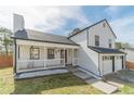 Charming home featuring a covered front porch and two-car garage at 785 Josh Ln, Lawrenceville, GA 30045