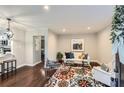 Bright living room boasts hardwood floors, neutral walls, and a stylish area rug at 3395 Lake Valley Nw Rd, Atlanta, GA 30331