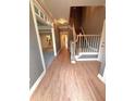 Inviting foyer featuring hardwood floors, staircase, and detailed trim work at 7155 Roswell Rd # 37, Sandy Springs, GA 30328