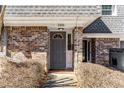 Inviting front entrance with a dark gray door, brick facade, and well-maintained shrubbery at 1106 Hampton Ne Way, Atlanta, GA 30324