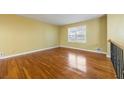 Bright living room featuring gleaming hardwood floors, neutral walls, and natural light from a large window at 2101 Newgate Dr, Decatur, GA 30035