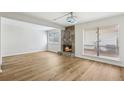 Spacious living room features a stone fireplace and wood-look flooring at 2979 Grey Squirrel Se Ct, Marietta, GA 30067
