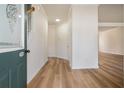 Bright foyer with wood-look floors leading to the living areas; features a staircase and natural light at 2225 Saint Thomas Way, Suwanee, GA 30024