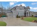 Beautiful two-story home with an attached garage and meticulously landscaped front yard at 430 Parkbrook Way, Canton, GA 30114