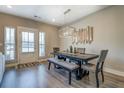Bright dining room with modern lighting, seating, and a sliding glass door at 1840 Eastmore Ave, Conyers, GA 30094