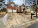 Charming brick home featuring a two-car garage and a spacious driveway at 6503 Foggy Oak Dr, Fairburn, GA 30213