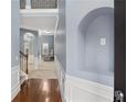 Inviting hallway with hardwood floors, archways and modern wall trim for a welcoming feel at 825 Bufflehead Ct, Stockbridge, GA 30281