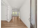 Bright entryway featuring hardwood floors and access to the living spaces at 14 Ramble Way, Sharpsburg, GA 30277