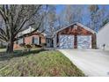 Charming brick home with an attached two-car garage and well-manicured front yard at 500 Allen'S Landing Ct, Lawrenceville, GA 30045