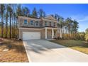 Inviting two-story home with a spacious driveway and well-maintained lawn at 129 Belvedere Rd, Mcdonough, GA 30253