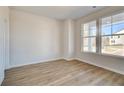 Cozy bonus room with natural light and luxury vinyl plank flooring at 129 Belvedere Rd, Mcdonough, GA 30253