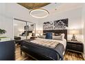 Stylish bedroom with a mirrored closet, chic lighting, and a comfortable bed with decorative pillows at 855 Peachtree St # 2901, Atlanta, GA 30308