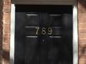 A close-up of the front door shows the house number 789 in gold lettering at 789 Celeste Sw Ln, Atlanta, GA 30331