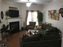 Cozy living room features a fireplace, hardwood floors, and a comfortable seating area at 789 Celeste Sw Ln, Atlanta, GA 30331