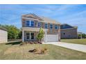 Beautiful brick home with a two-car garage and well-manicured lawn at 132 Dalston Cv, Stockbridge, GA 30281