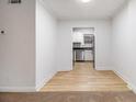Cozy dining area with wood floors leading into a kitchen with stainless steel appliances at 2367 Cascade Sw Rd # 9C, Atlanta, GA 30311