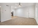 Inviting living room with modern ceiling fan, plush carpeting, and access to the kitchen at 2367 Cascade Sw Rd # 9C, Atlanta, GA 30311
