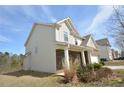 Charming house with vinyl siding and brick accents, surrounded by lush greenery at 2417 Overlook Ave, Lithonia, GA 30058