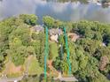 Aerial view of estate including luxury home and access to the lake at 2554 Emerald Dr, Jonesboro, GA 30236