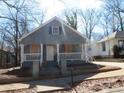Charming bungalow-style home with a cozy front porch and shaker siding at 7 Whatley Se St, Atlanta, GA 30315