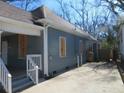 Side view of a home featuring the side yard and concrete steps at 7 Whatley Se St, Atlanta, GA 30315