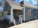Side view of a home featuring a welcoming front porch and concrete steps at 7 Whatley Se St, Atlanta, GA 30315