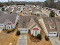 An aerial shot showcasing the home's location within a quiet residential neighborhood with mature trees at 740 Azalea Ave, Mcdonough, GA 30253