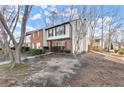 Well-maintained townhome showcasing a blend of brick and siding in a serene neighborhood setting at 6440 Wedgewood Trce, Tucker, GA 30084