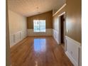 Bright dining room with hardwood floors, wainscoting, and a stylish chandelier at 50 Cold Springs Ct, Covington, GA 30016