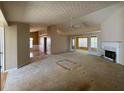 Open-concept living room featuring a cozy fireplace and abundant natural light at 50 Cold Springs Ct, Covington, GA 30016