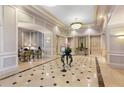 Elegant lobby with marble floors, decorative moldings, and stylish furnishings at 199 14Th Ne St # 1704, Atlanta, GA 30309