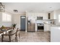 Bright eat-in kitchen features stainless appliances and quartz countertops at 2542 Warwick Ne Cir, Atlanta, GA 30345