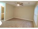 Neutral living room with ceiling fan, carpet, and view to bathroom with vanity at 2649 Fieldstone View Se Ln, Conyers, GA 30013