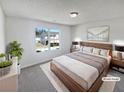 Bright, staged bedroom featuring a neutral color palette, cozy furnishings, and large window at 3180 Oakley Pl, Union City, GA 30291